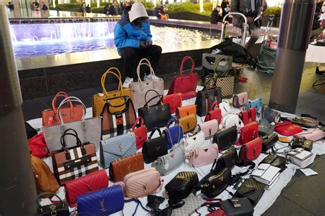 Dozens of fake designer purse vendors selling knock.